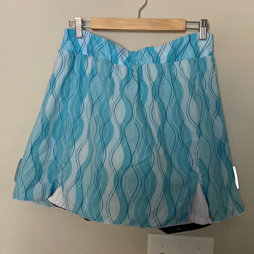 Women’s biking shorts, teal with white shorts, great seat padding. XL